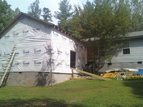 Tyvek wrapped gable on a new room addition beside an existing home in Plymouth